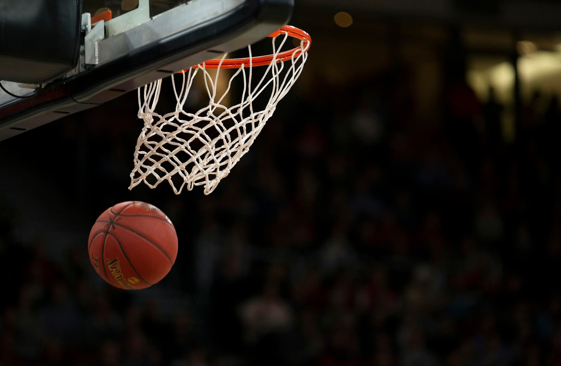 Basketball players during a community game indoors