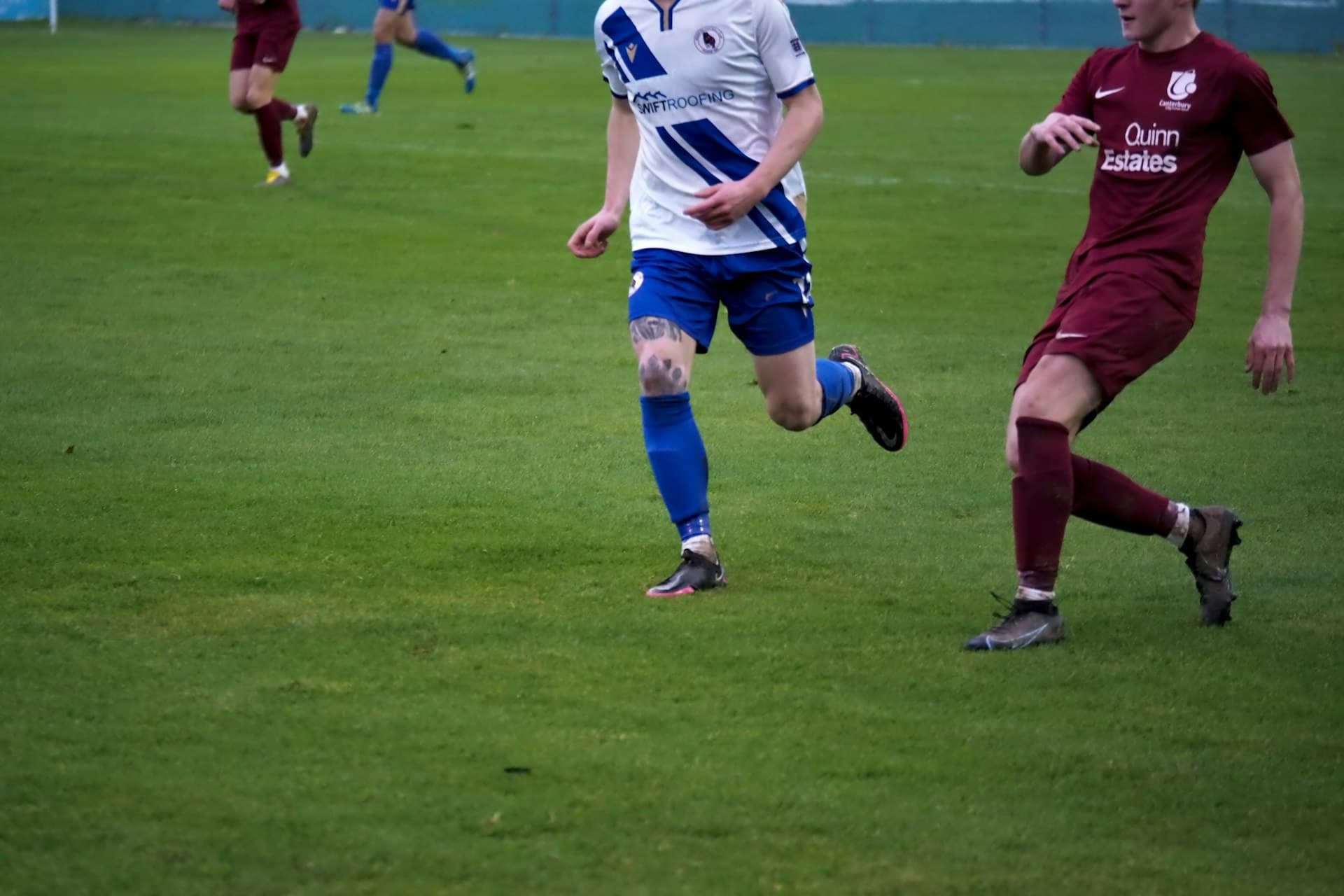 Grassroots football match at a community ground in Kent, UK