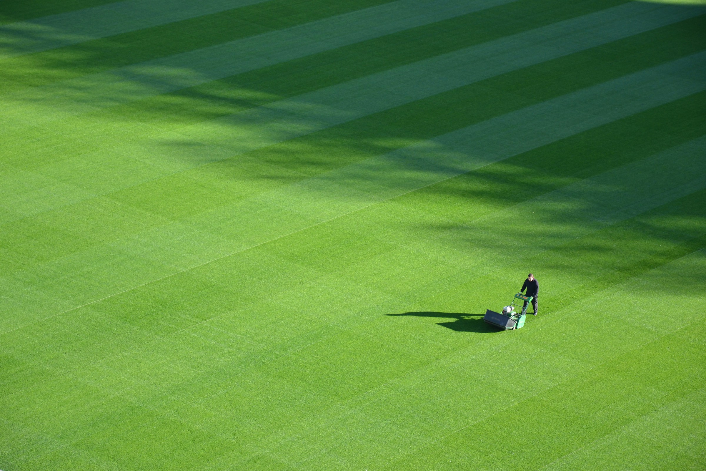 Manicured football pitch with striped grass